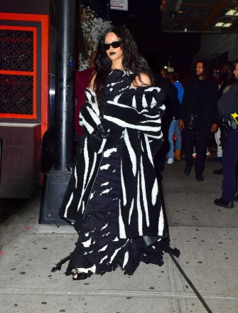 New York, NY  - *EXCLUSIVE*  - Singer Rihanna channels her inner Beetle Juice as she steps out for her brother Rory's Halloween party in NYC at 5am. The singer stepped out in a black and white dress and matching coat for the event.

Pictured: Rihanna

BACKGRID USA 1 NOVEMBER 2021 

BYLINE MUST READ: PapCulture / BACKGRID

USA: +1 310 798 9111 / usasales@backgrid.com

UK: +44 208 344 2007 / uksales@backgrid.com

*UK Clients - Pictures Containing Children
Please Pixelate Face Prior To Publication*