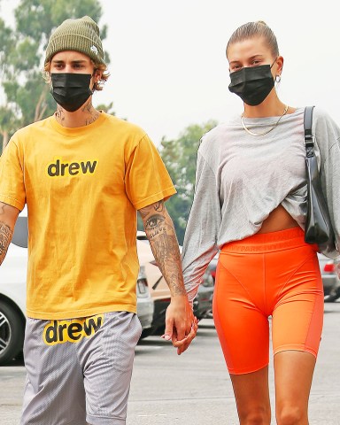 Justin Bieber and wife Hailey Bieber at pilates class. 12 Sep 2020 Pictured: Justin and Hailey Bieber. Photo credit: CrownMedia/MEGA TheMegaAgency.com +1 888 505 6342 (Mega Agency TagID: MEGA700383_002.jpg) [Photo via Mega Agency]