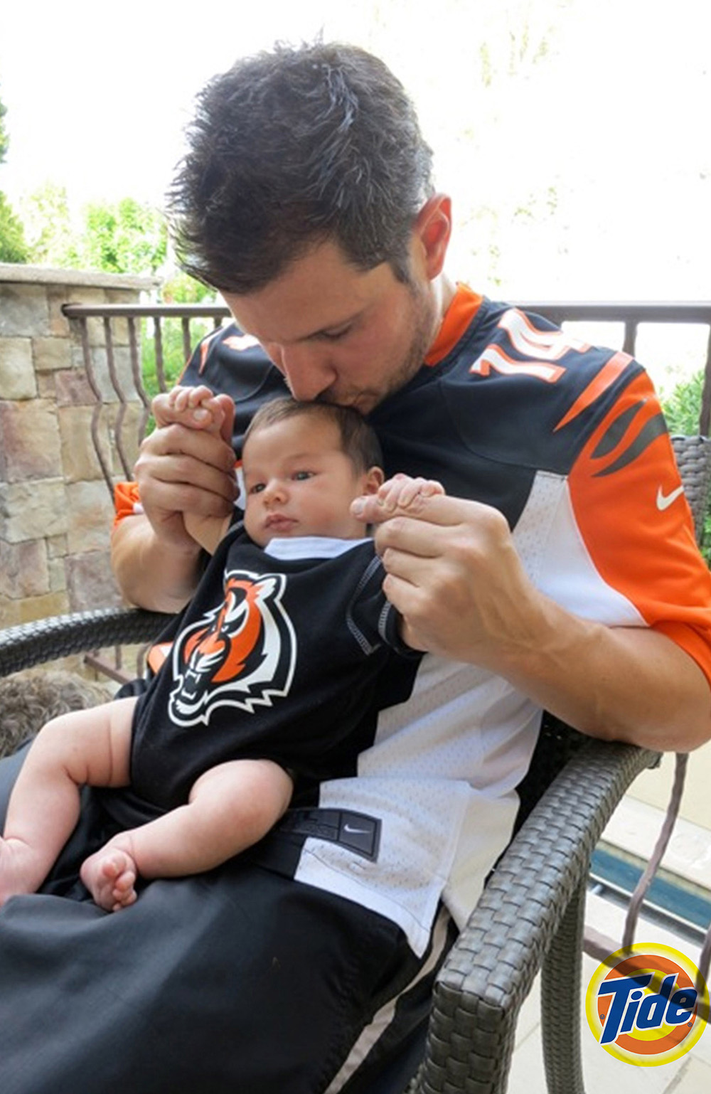 Nick Lachey and his infant son wear matching black and orange Cincinnati Bengals jerseys in a new ad campaign for Tide. One-month-old Camden John sits on his famous father's lap in the image, released as part of the the laundry detergent brand's  Show Us Your Colors promotion. Tide is urging NFL fans to go to their Facebook page - http://www.facebook.com/tide - or Tide.com to upload a photo of the time they were most proud to wear their team's colors, in a bid to win an all expenses paid trip for two to Super Bowl XLVII in New Orleans, LA. Camden was born on September 12 to Nick, 38, and wife Vanessa. *MANDATORY BYLINE - SPLASH NEWS/TIDE.COM*Pictured: Nick Lacheyson CamdenRef: SPL446604 121012 NON-EXCLUSIVEPicture by: SplashNews.comSplash News and PicturesUSA: +1 310-525-5808London: +44 (0)20 8126 1009Berlin: +49 175 3764 166photodesk@splashnews.comWorld Rights