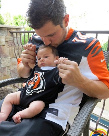 Nick Lachey and his infant son wear matching black and orange Cincinnati Bengals jerseys in a new ad campaign for Tide. One-month-old Camden John sits on his famous father's lap in the image, released as part of the the laundry detergent brand's  Show Us Your Colors promotion. Tide is urging NFL fans to go to their Facebook page - http://www.facebook.com/tide - or Tide.com to upload a photo of the time they were most proud to wear their team's colors, in a bid to win an all expenses paid trip for two to Super Bowl XLVII in New Orleans, LA. Camden was born on September 12 to Nick, 38, and wife Vanessa. *MANDATORY BYLINE - SPLASH NEWS/TIDE.COM*Pictured: Nick Lacheyson CamdenRef: SPL446604 121012 NON-EXCLUSIVEPicture by: SplashNews.comSplash News and PicturesUSA: +1 310-525-5808London: +44 (0)20 8126 1009Berlin: +49 175 3764 166photodesk@splashnews.comWorld Rights