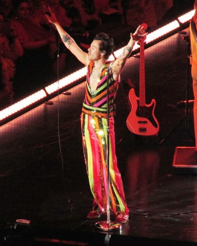 Harry Styles shows off his colorful style as she takes the stage for the 15th and final time at his record breaking residency inside Madison Square Garden in New York City. 22 Sep 2022 Pictured: Harry Styles. Photo credit: Brian Prahl/MEGA TheMegaAgency.com +1 888 505 6342 (Mega Agency TagID: MEGA900310_001.jpg) [Photo via Mega Agency]