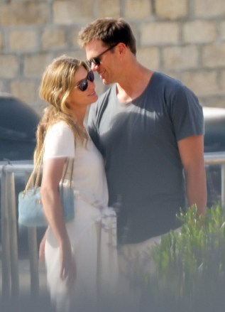 Saint-Tropez, FRANCE  - *EXCLUSIVE*  - Tom Brady cuddles up to his wife, Gisele Bunchchen, as the couple enjoys a romantic getaway to Saint Tropez. The Brazilian model smiled as Tom leaned in and whispered in her ear as the couple was spotted briefly over the weekend during a casual outing. The pair, who have been married for 13 years, has been enjoying some time together before Tom returns to the field again for his 23rd NFL season after initially announcing his retirement in February. The seven-time Super Bowl champion and five-time Super Bowl MVP announced roughly a month later that he'd changed his mind and would play another season with the Buccaneers.

*PHOTOS SHOT ON 06/27/2022*

Pictured: Gisele Bundchen, Tom Brady

BACKGRID USA 29 JUNE 2022 

BYLINE MUST READ: BACKGRID

USA: +1 310 798 9111 / usasales@backgrid.com

UK: +44 208 344 2007 / uksales@backgrid.com

*UK Clients - Pictures Containing Children
Please Pixelate Face Prior To Publication*