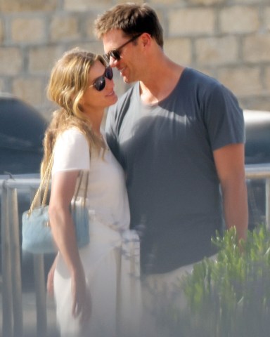 Saint-Tropez, FRANCE  - *EXCLUSIVE*  - Tom Brady cuddles up to his wife, Gisele Bunchchen, as the couple enjoys a romantic getaway to Saint Tropez. The Brazilian model smiled as Tom leaned in and whispered in her ear as the couple was spotted briefly over the weekend during a casual outing. The pair, who have been married for 13 years, has been enjoying some time together before Tom returns to the field again for his 23rd NFL season after initially announcing his retirement in February. The seven-time Super Bowl champion and five-time Super Bowl MVP announced roughly a month later that he'd changed his mind and would play another season with the Buccaneers.

*PHOTOS SHOT ON 06/27/2022*

Pictured: Gisele Bundchen, Tom Brady

BACKGRID USA 29 JUNE 2022 

BYLINE MUST READ: BACKGRID

USA: +1 310 798 9111 / usasales@backgrid.com

UK: +44 208 344 2007 / uksales@backgrid.com

*UK Clients - Pictures Containing Children
Please Pixelate Face Prior To Publication*