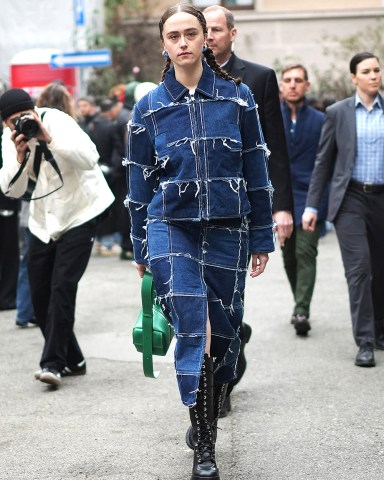 Model Ella Emhoff, Stepdaughter of US VP Kamala Harris, and In Denim Patch Jacket and Denim Patch Skirt and With Wednesday Addams Braids Attends Sunnei Fashion Show In Milan With Her Security Team. 24 Feb 2023 Pictured: Ella Emhoff. Photo credit: Tim Regas / MEGA TheMegaAgency.com +1 888 505 6342 (Mega Agency TagID: MEGA946938_001.jpg) [Photo via Mega Agency]