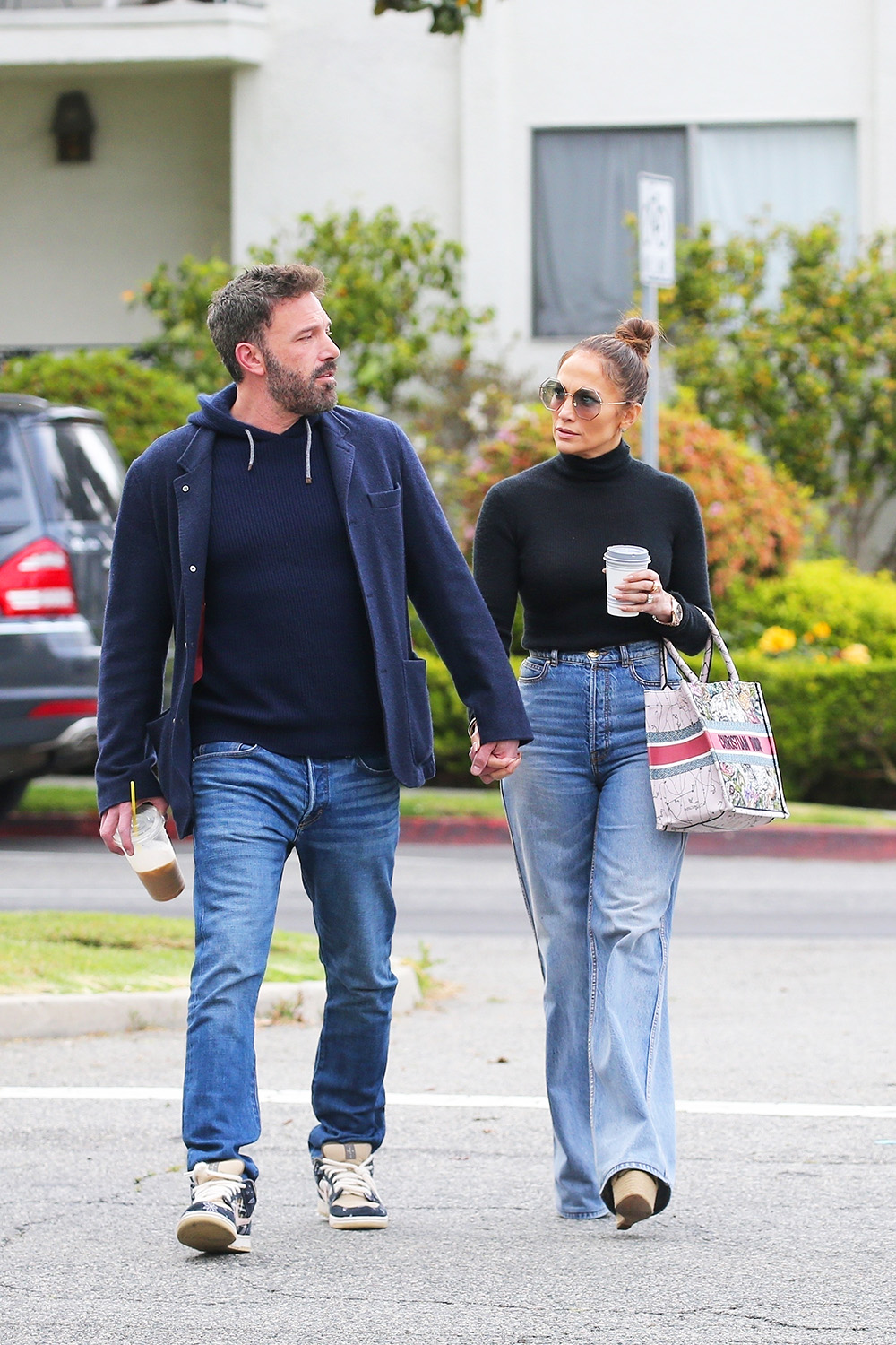 Santa Monica, CA  - *EXCLUSIVE*  - Ben Affleck and Jennifer Lopez coordinate in denim as the pair are seen enjoying their coffees while starting off their day. Jlo sported high waisted flared jeans paired witha. high neck top and wedges. The singer carried a stylish Christian Dior tote for the outing and swept her hair into a high bun.

Pictured: Ben Affleck, Jennifer Lopez

BACKGRID USA 9 MAY 2023 

USA: +1 310 798 9111 / usasales@backgrid.com

UK: +44 208 344 2007 / uksales@backgrid.com

*UK Clients - Pictures Containing Children
Please Pixelate Face Prior To Publication*