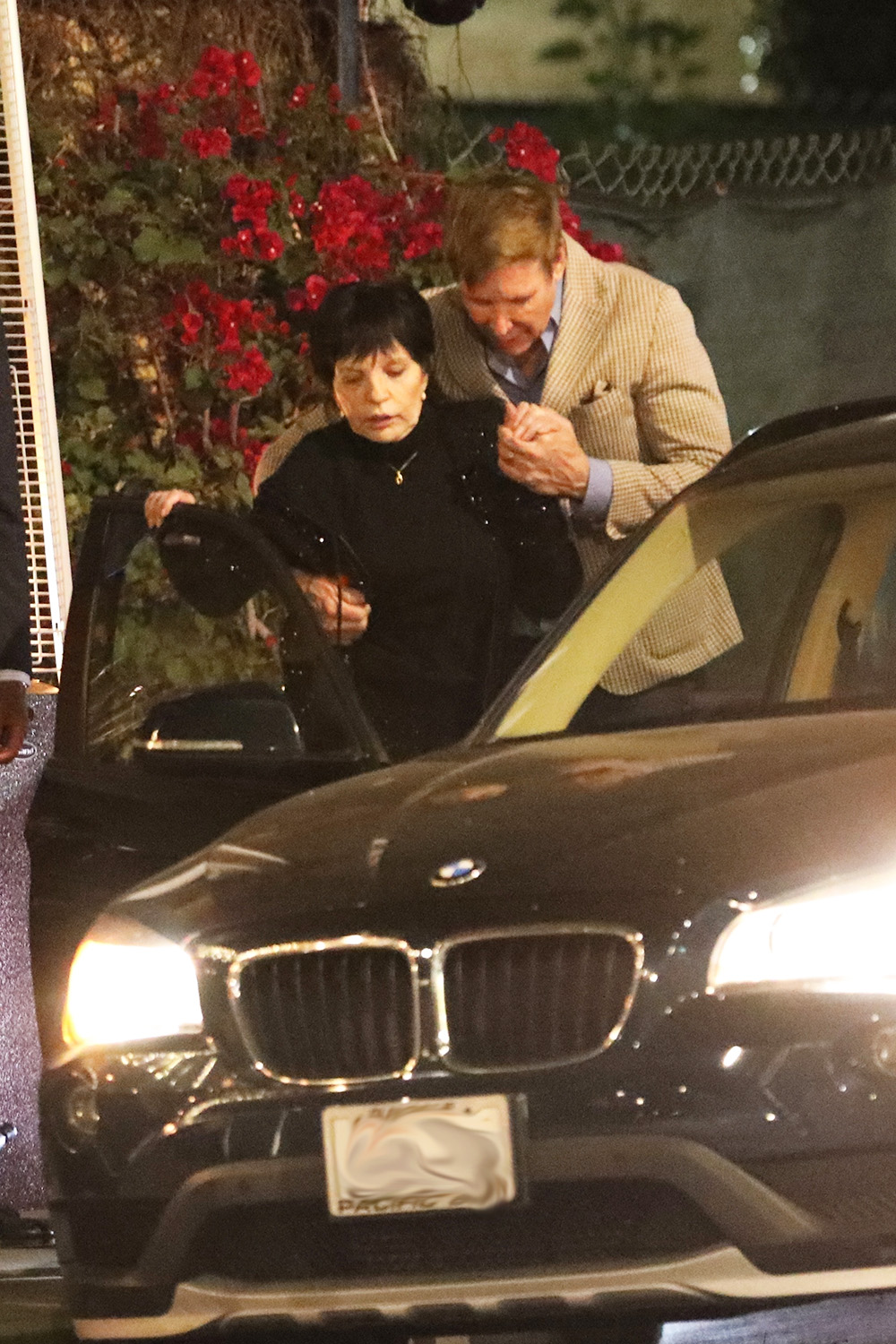 West Hollywood, CA  - *EXCLUSIVE*  - Liza Minnelli gets a helping hand from her caretaker and friend as she leaves Il Piccolo restaurant after having dinner with actor George Hamilton in West Hollywood. The 76 year old actress was seen being escorted from the restaurant in a wheelchair. At one point, the caretaker and friend had a little trouble getting Liza into the car but eventually it all worked out. After dinner, Liza and George chatted for 5 minutes before parting ways.

Pictured: Liza Minnelli, George Hamilton

BACKGRID USA 21 MARCH 2022 

USA: +1 310 798 9111 / usasales@backgrid.com

UK: +44 208 344 2007 / uksales@backgrid.com

*UK Clients - Pictures Containing Children
Please Pixelate Face Prior To Publication*