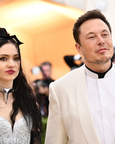 Grimes, left, and Elon Musk attend The Metropolitan Museum of Art's Costume Institute benefit gala in New York on . The Tesla and SpaceX founder tells the New York Post that he and the Canadian singer are "semi-separated." But he says they remain on good terms, she still lives at his house in California and they continue to raise their 1-year-old son together
People-Elon Musk Grimes, New York, United States - 07 May 2018