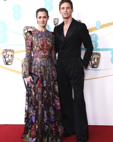 Eddie Redmayne, right, and Hannah Bagshawe pose for photographers upon arrival at the 76th British Academy Film Awards, BAFTA's, in LondonBAFTA Film Awards 2023 Red Carpet, London, United Kingdom - 19 Feb 2023