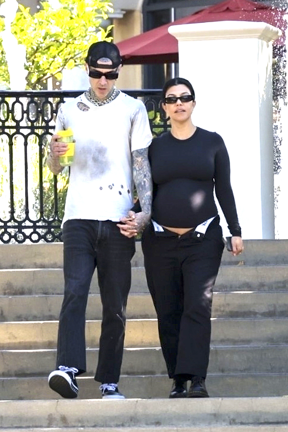 Los Angeles, CA  - *EXCLUSIVE*  - Kourtney Kardashian confidently shows off her baby bump while holding hands with Travis Barker as they go for a coffee run near their Calabasas home. Travis exudes a cool vibe, while Kourtney rocks a stylish all-black outfit and completes her look with sunglasses.

Pictured: Kourtney Kardashian,Travis Barker

BACKGRID USA 20 JULY 2023 

USA: +1 310 798 9111 / usasales@backgrid.com

UK: +44 208 344 2007 / uksales@backgrid.com

*UK Clients - Pictures Containing Children
Please Pixelate Face Prior To Publication*