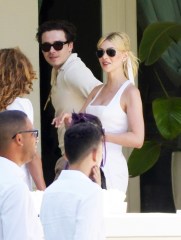 Newlyweds Brooklyn and Nicola Peltz look radiant as they step out for brunch on Sunday the day after their flashy Palm Beach nuptials. 

Husband and wife were seen at the Peltz familys stunning Florida pad on day three of the star-studded wedding extravaganza. 

The bride wore a white dress and matching ribbon in her flowing blonde ponytail while Brooklyn looked dapper in cream knitted shirt.

Their romantic outing came as a lavish brunch was being held at a huge marquee set up in sprawling tropical gardens out back of the Peltz residence.

David and Victorias eldest son and actress Nicola tied the knot at her ultra wealthy familys USD 76 million oceanfront estate.

Pictured: Brooklyn Beckham,Nicola Peltz
Ref: SPL5302812 100422 NON-EXCLUSIVE
Picture by: RM / SplashNews.com

Splash News and Pictures
USA: +1 310-525-5808
London: +44 (0)20 8126 1009
Berlin: +49 175 3764 166
photodesk@splashnews.com

World Rights