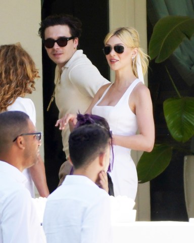 Newlyweds Brooklyn and Nicola Peltz look radiant as they step out for brunch on Sunday the day after their flashy Palm Beach nuptials. 

Husband and wife were seen at the Peltz familys stunning Florida pad on day three of the star-studded wedding extravaganza. 

The bride wore a white dress and matching ribbon in her flowing blonde ponytail while Brooklyn looked dapper in cream knitted shirt.

Their romantic outing came as a lavish brunch was being held at a huge marquee set up in sprawling tropical gardens out back of the Peltz residence.

David and Victorias eldest son and actress Nicola tied the knot at her ultra wealthy familys USD 76 million oceanfront estate.

Pictured: Brooklyn Beckham,Nicola Peltz
Ref: SPL5302812 100422 NON-EXCLUSIVE
Picture by: RM / SplashNews.com

Splash News and Pictures
USA: +1 310-525-5808
London: +44 (0)20 8126 1009
Berlin: +49 175 3764 166
photodesk@splashnews.com

World Rights