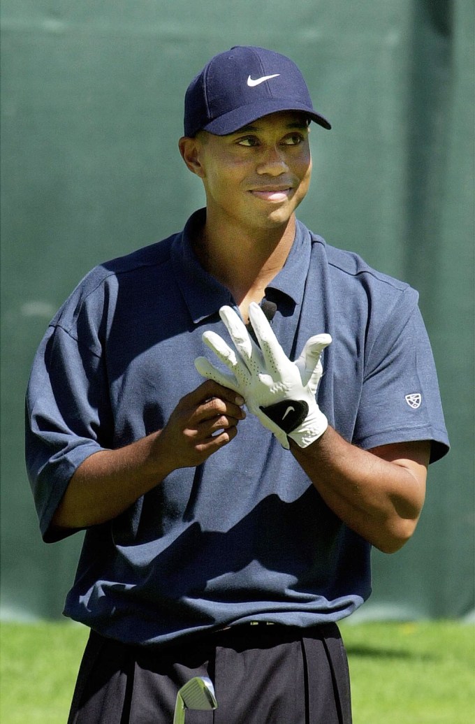 Tiger Woods Puts On A Glove