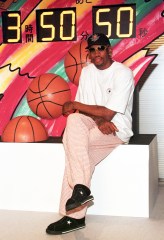 DENNIS RODMAN Chicago Bulls' rebounder Dennis Rodman poses in front of a countdown clock which shows the remain of time of his four-hour contract with the Fuji TV during a news conference at its headquarters in Tokyo . Rodman arrived today at the invitation of the Japan's TV company to appear on a variety programJAPAN RODMAN, TOKYO, Japan