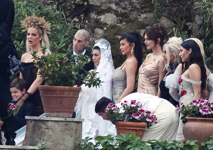 The family surround the bride and groom