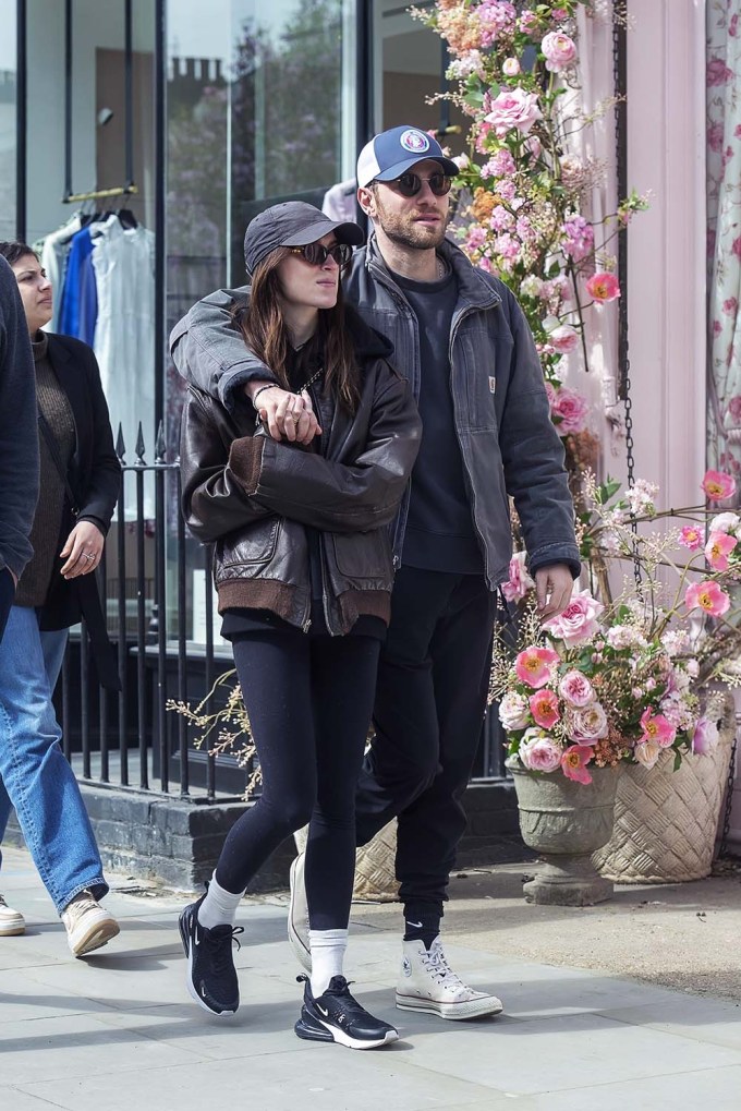 Phoebe Dynevor holds hands with actor Cameron Fuller