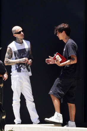 Calabasas, CA  - *EXCLUSIVE*  - Travis Barker is greeted by friends and employees as he makes a quick stop at his Calabasas recording studio, after a recent health scare and hospitalization.

Pictured: Travis Barker

BACKGRID USA 11 JULY 2022 

USA: +1 310 798 9111 / usasales@backgrid.com

UK: +44 208 344 2007 / uksales@backgrid.com

*UK Clients - Pictures Containing Children
Please Pixelate Face Prior To Publication*