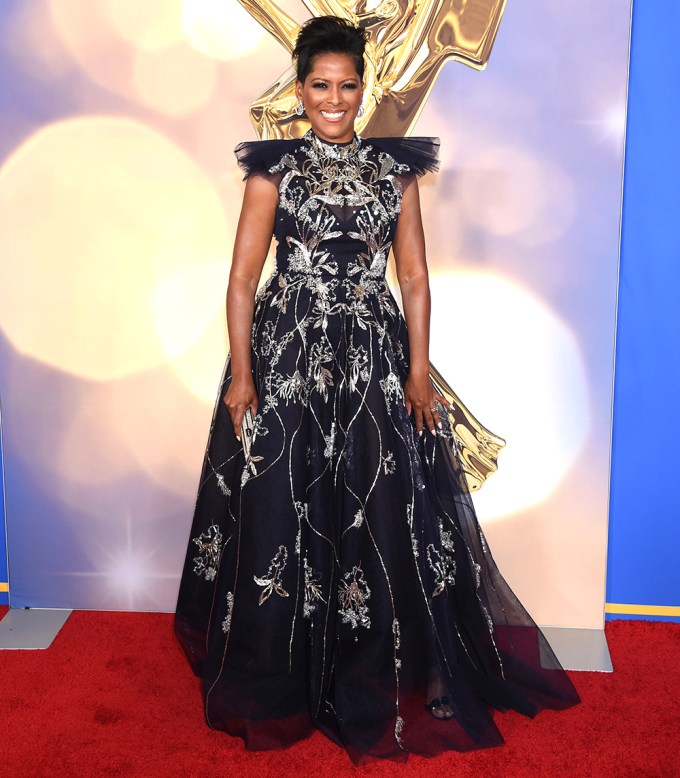 Tamron Hall smiles for photographers at the 49th Emmy Awards