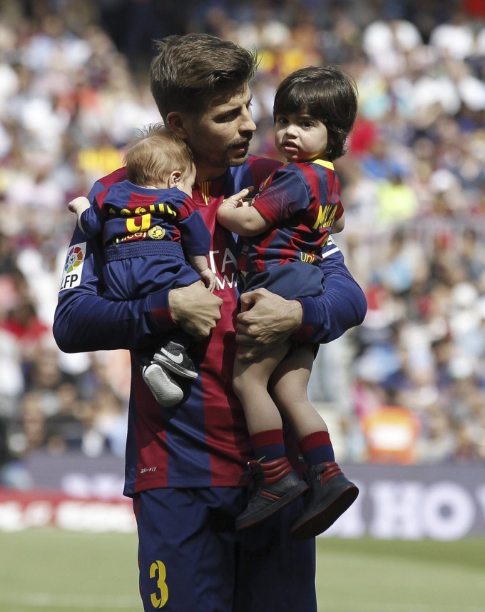 Gerard Pique Holds Sons Milan & Sasha