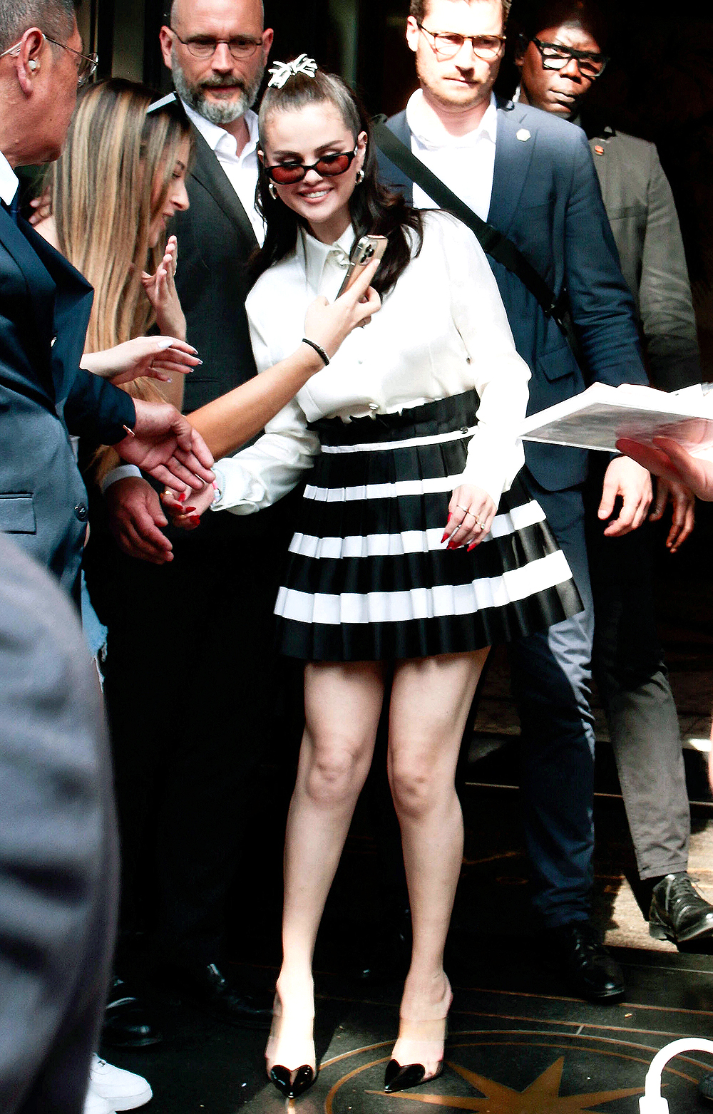 Thousands of fans waited outside the Bulgari hotel in Paris to see Selena Gomez after attending the Rare Beauty Event