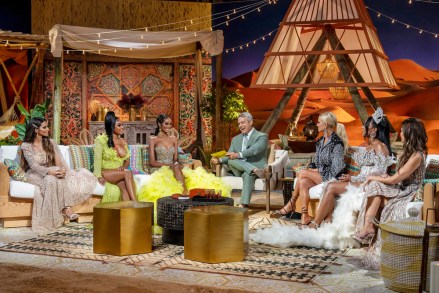 THE REAL HOUSEWIVES OF DUBAI -- "Reunion" -- Pictured: (l-r) Dr. Sara Al Medani, Lesa Milan, Chanel Ayan, Andy Cohen, Caroline Stanbury, Caroline Brooks, Nina Ali -- (Photo by: Zach Dilgard/Bravo)