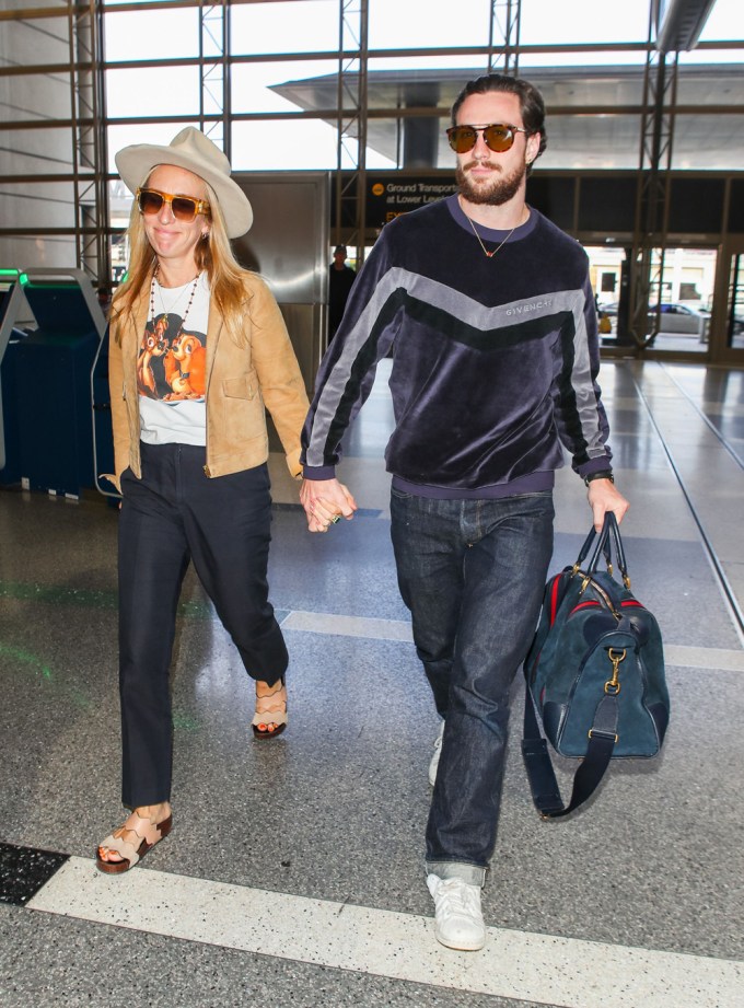 Aaron & Sam Taylor-Johnson At LAX