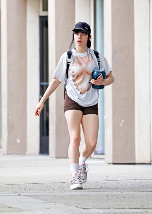 Los Angeles, CA  - *EXCLUSIVE*  - Singer Billie Eilish is out in Los Angeles with a big smile on her face as we catch her leaving the gym one week after her parent's home is doxxed by a crime app. Billie wears a quirky boob print top and brown workout shorts as she walks back to her car with a friend.

Pictured: Billie Eilish

BACKGRID USA 13 JANUARY 2023 

USA: +1 310 798 9111 / usasales@backgrid.com

UK: +44 208 344 2007 / uksales@backgrid.com

*UK Clients - Pictures Containing Children
Please Pixelate Face Prior To Publication*