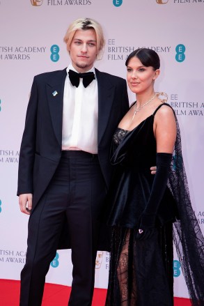 Millie Bobby Brown, left, and Jake Bongiovi pose for photographers upon arrival at the 75th British Academy Film Awards, BAFTA's, in LondonBafta Film Awards 2022 Arrivals, London, United Kingdom - 13 Mar 2022