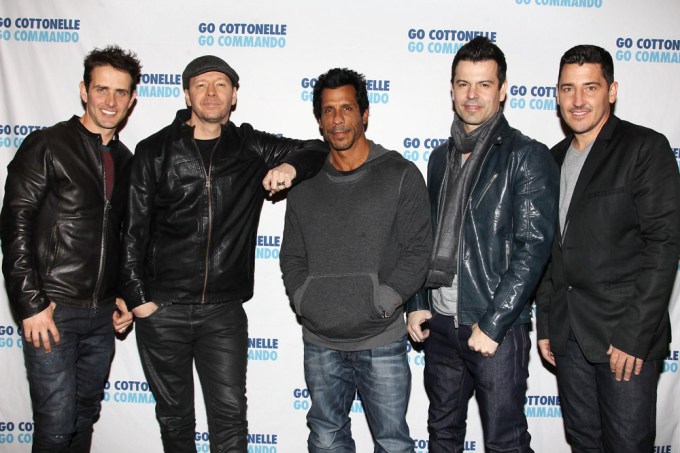 NKOTB pose at an event