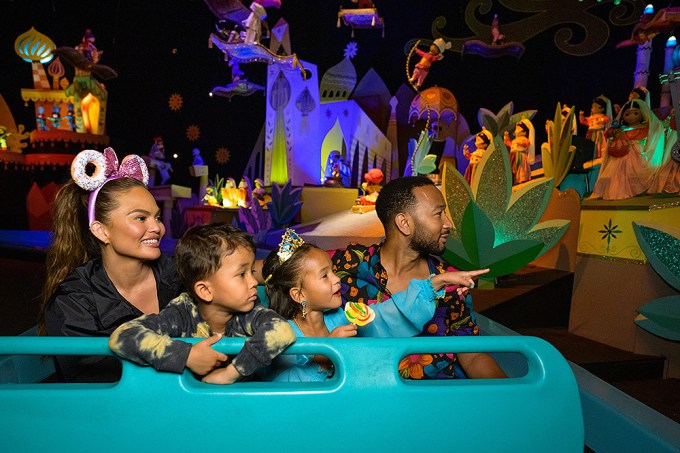 Chrissy Teigen & Family Ride ‘It’s a Small World’