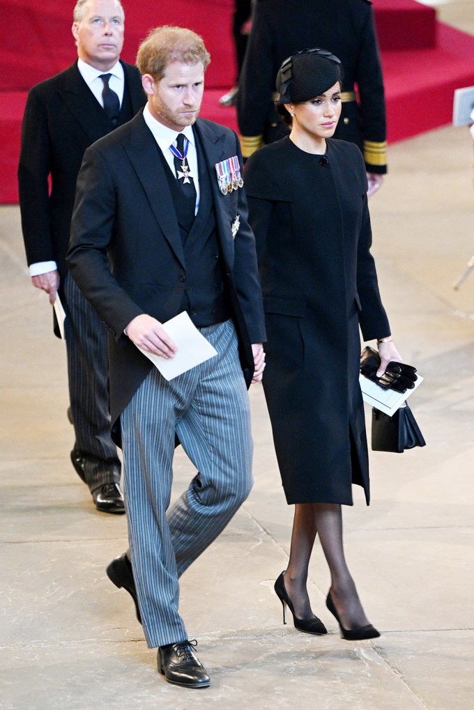 Prince Harry and Meghan Markle hold hands