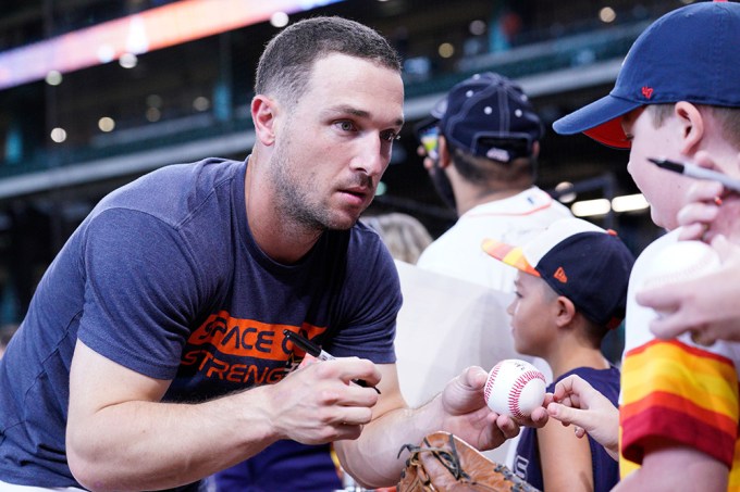 Alex Bregman Signs A Baseball For Fan