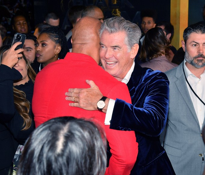 Dwayne Johnson & Pierce Brosnan Hug