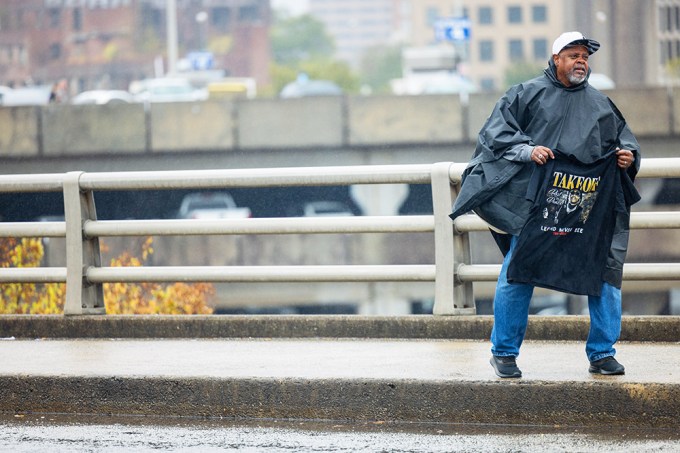 A Man Sells A Takeoff T-Shirt