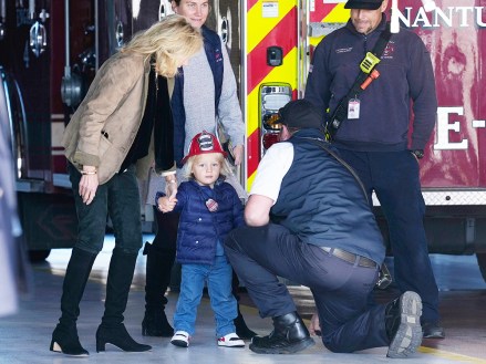 First Lady Jill Biden, left, holds the hand of her grandson Beau Biden, as they and President Joe Biden visit with firefighters on Thanksgiving Day at the Nantucket Fire Department in Nantucket, Mass
Biden, Nantucket, United States - 24 Nov 2022