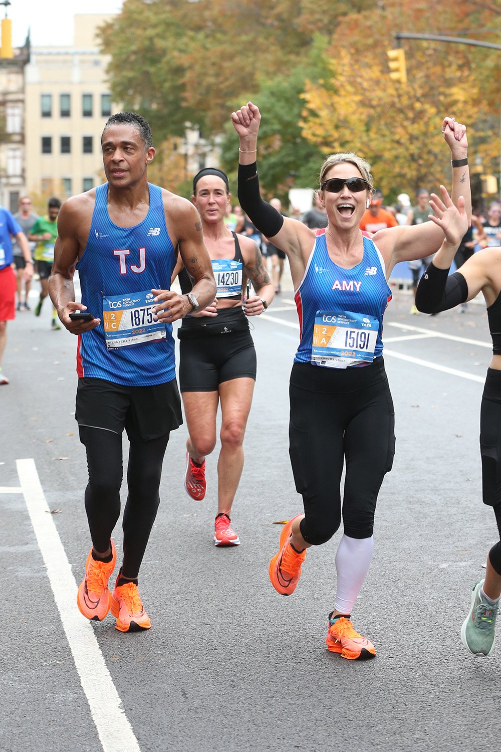 Amy Robach And T.J. Holmes Run Through Harlem In The New York City Marathon