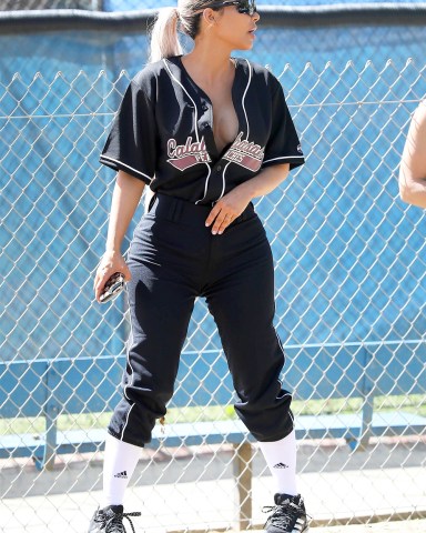 Calabasas, CA  - *EXCLUSIVE*  - Kim, Khloe and Kourtney Kardashian are joined by Kris and Kendall Jenner for a game of softball in Calabasas with friends. The Kardashian clan gathers for pictures after the game with Jonathan Cheban, Corey Gamble and Moises Arias. The ladies got some expert coaching advice from former Yankee Alex Rodriguez. Kim left her Calabasas Peaches Jersey unbuttoned enough to show off some cleavage.Pictured: Kim KardashianBACKGRID USA 8 MARCH 2018 BYLINE MUST READ: BAHE / BACKGRIDUSA: +1 310 798 9111 / usasales@backgrid.comUK: +44 208 344 2007 / uksales@backgrid.com*UK Clients - Pictures Containing ChildrenPlease Pixelate Face Prior To Publication*