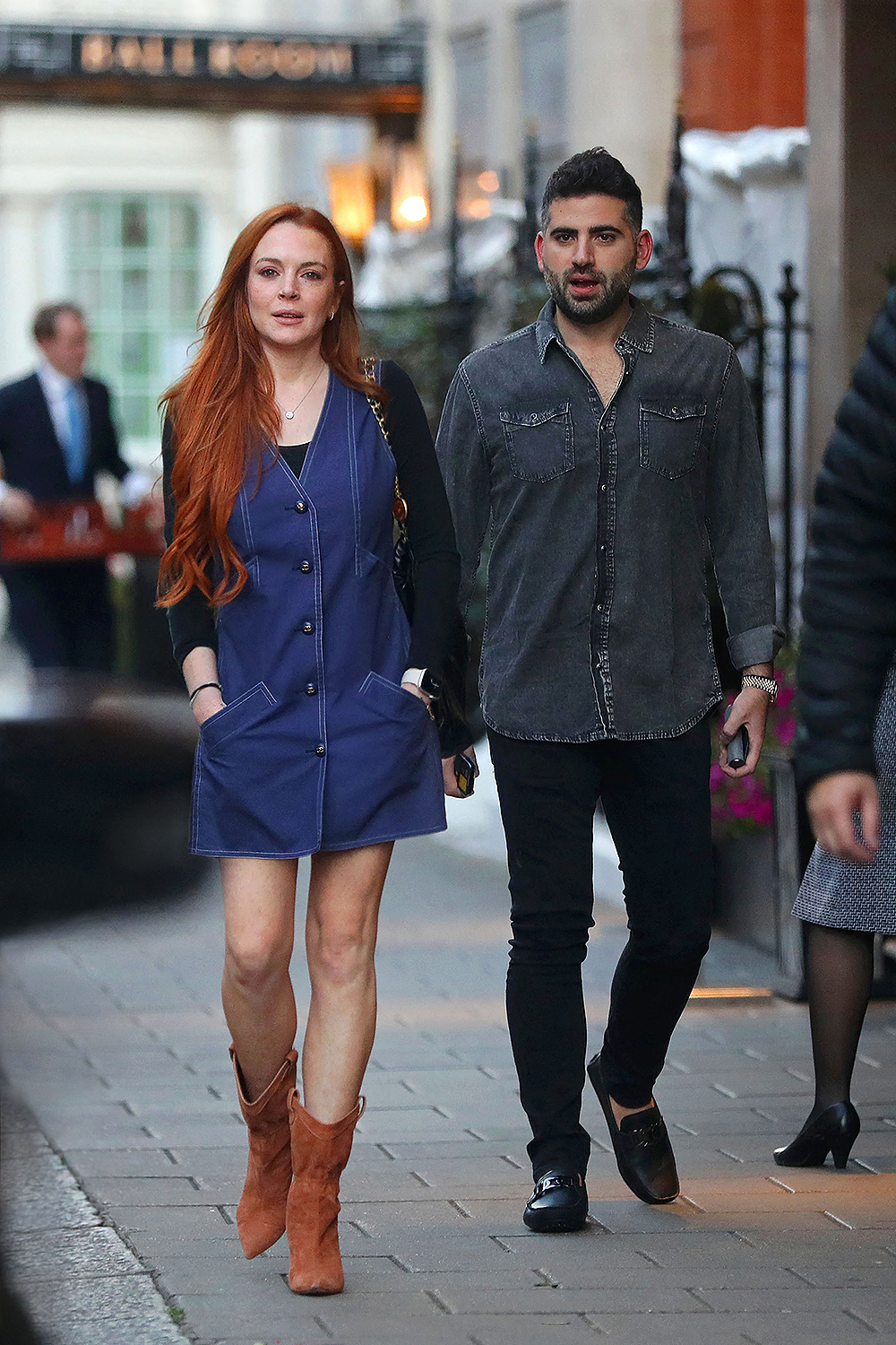 EXCLUSIVE: Lindsay Lohan looks so happy and healthy as she steps out with new husband Bader Shammas in first open public appearance together in London after secretly tying the knot