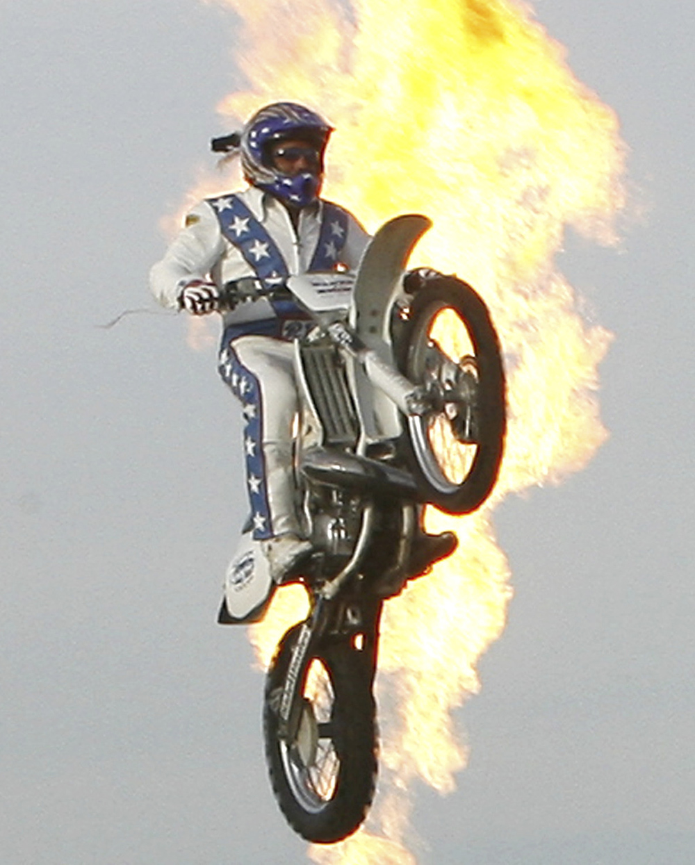 Daredevil Robbie Knievel is backlit in flames as he jumps over 24 delivery trucks, a 200 foot gap, at Kings Island amusement park in Mason, Ohio on . Knievel, an American stunt performer, died early Friday at a hospice in Reno, Nev., with his daughters at his side, his brother Kelly Knievel said. He was 60
Obit Robbie Knievel, Mason, United States - 24 May 2008