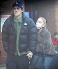 EXCLUSIVE: Ariana Grande and her husband Dalton Gomez indulge in Crepes from the famous La Creperie de Hampstead. The pint-sized pop star who is in the capital filming Wicked parts 1 & 2 looked adorable in an oversized coat, platform trainers, and a pink face mask that she removed to take some selfies near the popular stand that serves sweet and savoury french crêpes and has been a Hampstead favorite for many years. 23 Jan 2023 Pictured: Ariana Grande, Dalton Gomez. Photo credit: MEGA TheMegaAgency.com +1 888 505 6342 (Mega Agency TagID: MEGA939190_041.jpg) [Photo via Mega Agency]