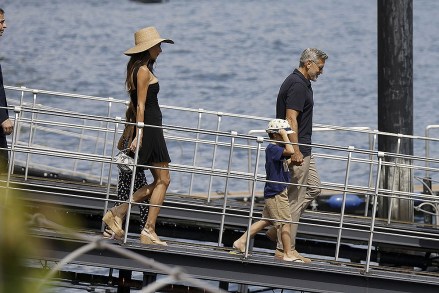 Como, ITALY  - George and Amal Clooney, along with their sleepy kids Ella and Alexander, embark on a boat trip in Como. Waving at passersby, George sports a classy look with sunglasses, a blue shirt, and khaki pants, while Amal turns heads in a sun hat and black dress

Pictured: George Clooney, Amal Clooney

BACKGRID USA 28 JULY 2023 

USA: +1 310 798 9111 / usasales@backgrid.com

UK: +44 208 344 2007 / uksales@backgrid.com

*UK Clients - Pictures Containing Children
Please Pixelate Face Prior To Publication*