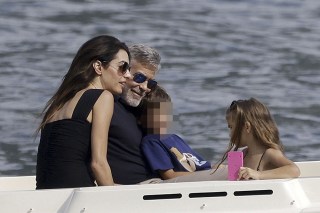 Como, ITALY  - George and Amal Clooney, along with their sleepy kids Ella and Alexander, embark on a boat trip in Como. Waving at passersby, George sports a classy look with sunglasses, a blue shirt, and khaki pants, while Amal turns heads in a sun hat and black dress

Pictured: George Clooney, Amal Clooney

BACKGRID USA 28 JULY 2023 

USA: +1 310 798 9111 / usasales@backgrid.com

UK: +44 208 344 2007 / uksales@backgrid.com

*UK Clients - Pictures Containing Children
Please Pixelate Face Prior To Publication*