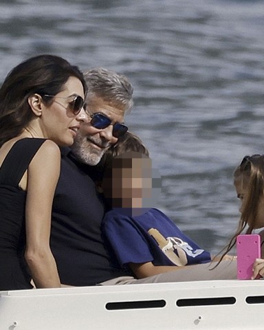 Como, ITALY  - George and Amal Clooney, along with their sleepy kids Ella and Alexander, embark on a boat trip in Como. Waving at passersby, George sports a classy look with sunglasses, a blue shirt, and khaki pants, while Amal turns heads in a sun hat and black dress

Pictured: George Clooney, Amal Clooney

BACKGRID USA 28 JULY 2023 

USA: +1 310 798 9111 / usasales@backgrid.com

UK: +44 208 344 2007 / uksales@backgrid.com

*UK Clients - Pictures Containing Children
Please Pixelate Face Prior To Publication*