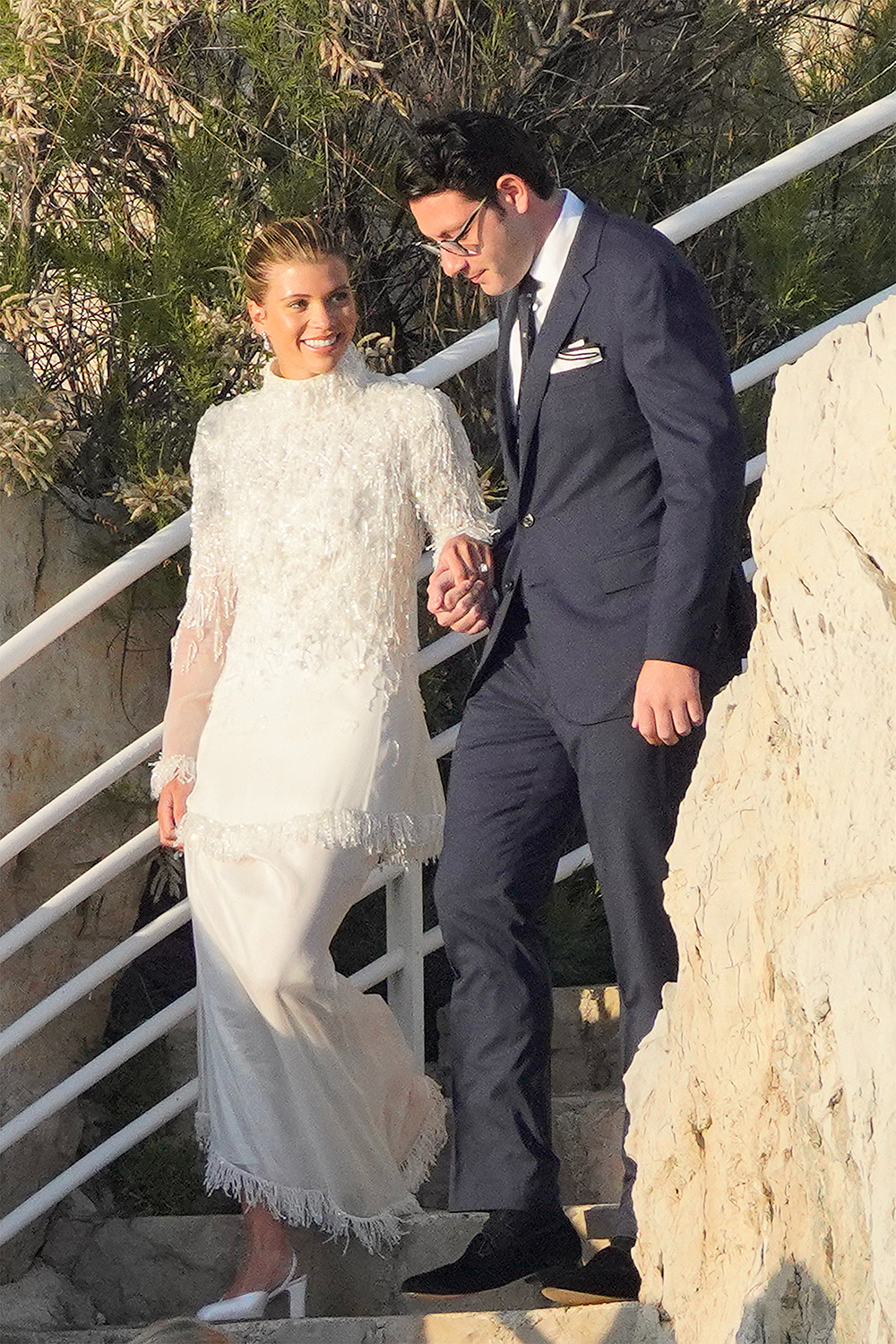 Blushing bride Sofia Richie looks radiant in an elegant white gown as she celebrates her lavish wedding weekend in the French Riviera.