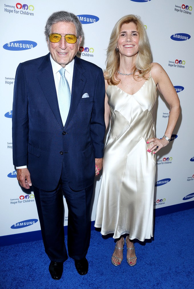 Tony Bennett & Susan Crow on a blue carpet