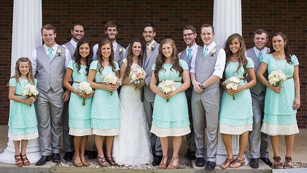 Duggar family posing at Jill Duggar and Derick Dillard's wedding