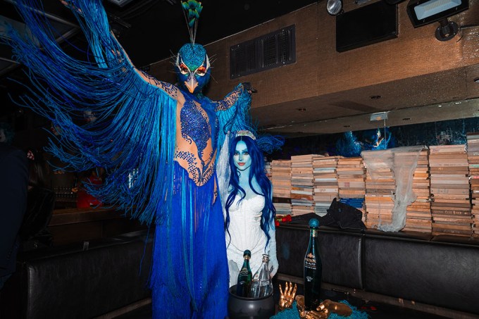 Heidi Klum as a peacock with Becky G