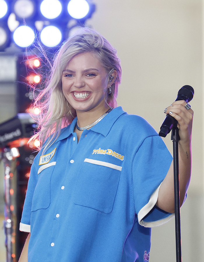 Renee Rapp singing at Rockefeller Center