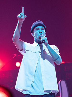 Tyler Joseph on stage performing with Twenty One Pilots