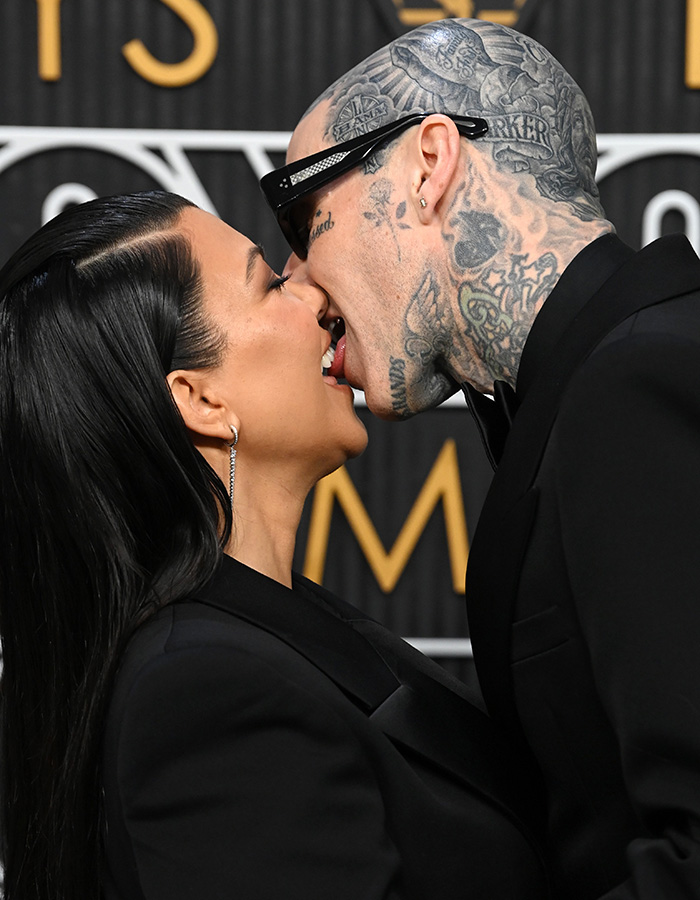 Kourtney Kardashian kissing Travis Barker at the 2023 Emmys