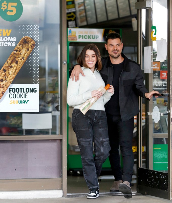 **EXCLUSIVE** PhotoCredit: MOVI Inc. Date:02/08/2024 Taylor and Tay Lautner enjoy one of Subway’s new Sidekicks in Los Angeles. Subway partnered with the duo to promote its new shareable snacks – footlong cookies, churros and pretzels.